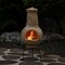 Outdoor Clay Chiminea Fireplace Sun Design Wood Burning Fire Pit with Sturdy Metal Stand, Barbecue, Cocktail Party, Cozy Nights Fire Pit